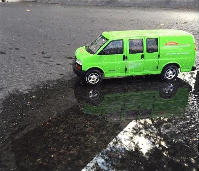 SERVPRO van in a flooded parking lot