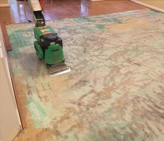 Removed hardwood flooring using a floor scraper