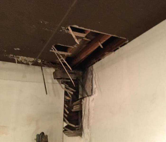 Fire damage to ceiling and walls in a local business