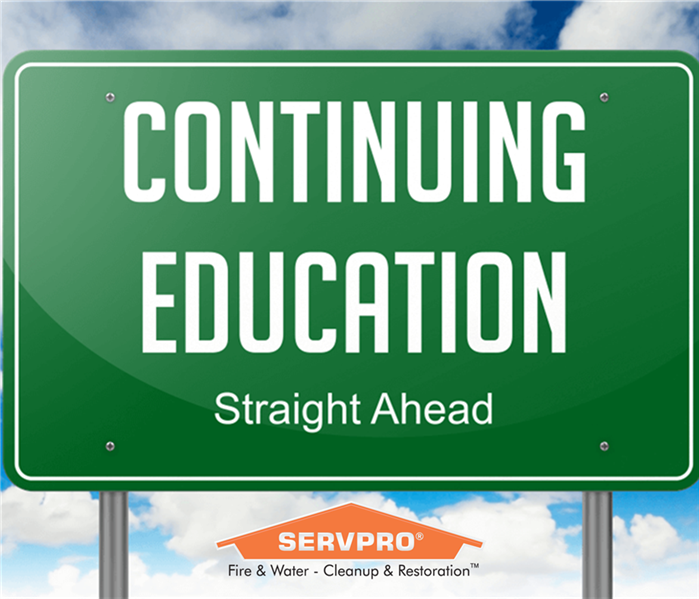"Continuing Education" road sign with SERVPRO logo