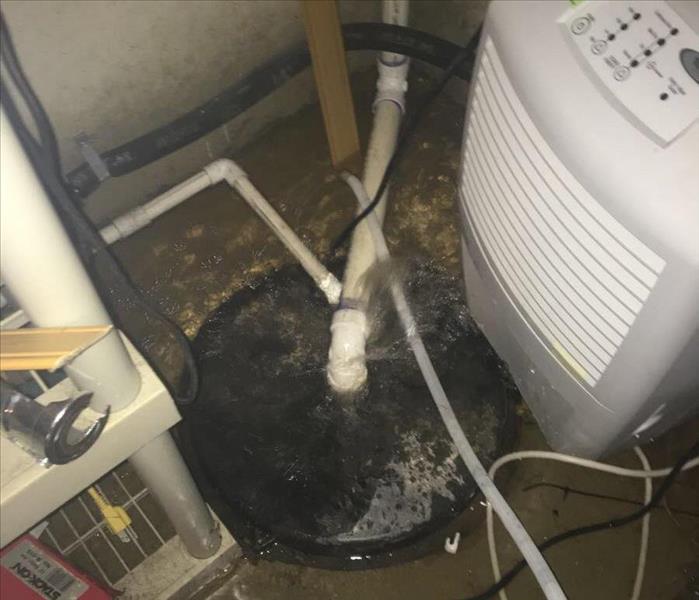 Sump Pump in affected residential maintenance closet