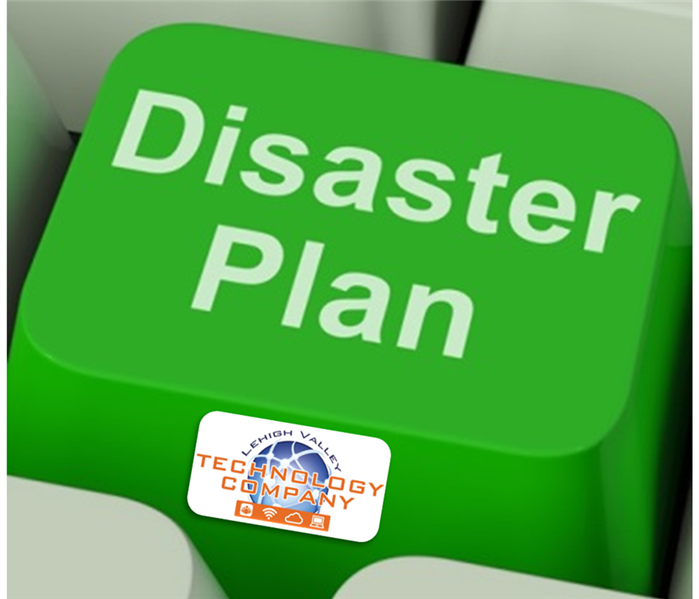 Green computer key with the words "Disaster Plan" across the top